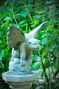 The gargoyle watches the herb garden