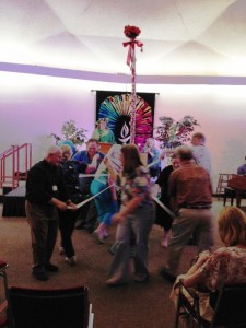 Morris dancers around the May pole during CUUPS led service